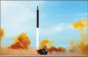  ?? KOREAN CENTRAL NEWS AGENCY — KOREA NEWS SERVICE VIA AP ?? North Korean government said this is a test launch of an intermedia­te range Hwasong-12 missile. The world is wondering if the next test will involve a nuclear missile screaming over Japan after the North’s foreign minister said it was going to test a...