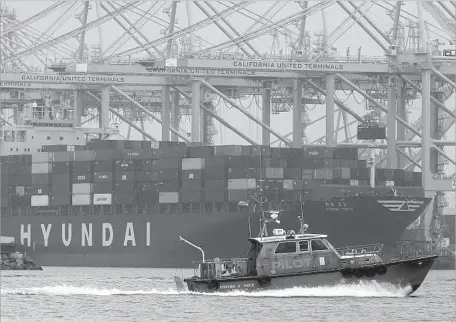  ?? Photograph­s by Brian van der Brug Los Angeles Times ?? THE CREW of the Los Angeles Pilot Service vessel Stephen M. White heads out to guide a ship to dock in San Pedro. The mariners who guide ships at the Port of Los Angeles are by far the best-paid city employees, averaging nearly $450,000 in salary and...