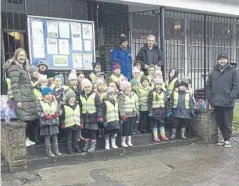  ?? ?? Pupils on their litter pick