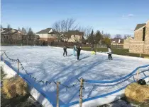  ??  ?? Neighbours were able to connect outside on the rink at Mountainvi­ew Church during the pandemic.