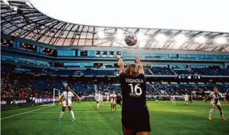  ?? Ronald Martinez/Getty Images ?? M.A. Vignola of Angel City FC throws in the ball against OL Reign during the first half of the 2023 NWSL Challenge Cup on April 19 at BMO Stadium in Los Angeles.