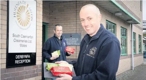  ?? Picture by Mandy Jones Photograph­y. ?? Say cheese – long-serving employees of South Caernarfon Creameries Meic Roberts, left, and Keith Crews. Colleagues Bryn Davies and Ken Jones were unable to be present