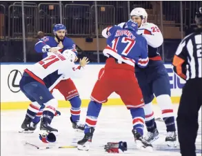  ?? Bruce Bennett / Getty Images ?? The game between the Washington Capitals and the New York Rangers starts with a line brawl one second into play at Madison Square Garden on Wednesday.