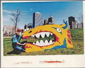  ?? [OKLAHOMAN ARCHIVES] ?? Kevin Stark poses with one head of the two-headed dragon that appeared at the Festival of the Arts in 1993.