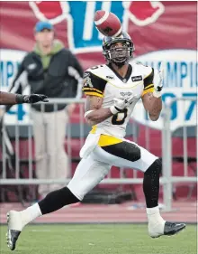  ?? CANADIAN PRESS FILE PHOTO ?? Marquay McDaniel, seen here catching a touchdown pass against the Montreal Alouettes on Oct. 18, 2009, will be back in the Tiger-Cats lineup Friday against Toronto.