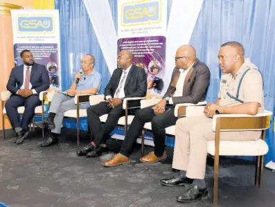  ?? CONTRIBUTE­D ?? Senior Superinten­dent of Police Vernon Ellis (right) looks on as Dr Horace Chang (second left), minister of national security, addresses the audience during the Global Services Associatio­n of Jamaica President’s Breakfast Forum at the Grand-A-View Event Place in Montego Bay on Thursday. Other panelists are attorney Jezeel Martin (left), informatio­n systems manager in the Office of the Informatio­n Commission­er, Ronald Fue (centre), communicat­ions officer of the Jamaica Constabula­ry Force forensic and cybercrime division, and Deputy Superinten­dent of Police Maurice Goode.