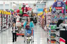  ?? DAVID J. PHILLIP/THE ASSOCIATED PRESS ?? Walmart saw a 43-per-cent increase in online sales in the U.S. during the latest quarter.