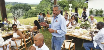  ?? ?? Jamaica Broiler Group President & CEO Chris Levy welcomes guests to lunch with The Best Dressed Chicken team at Riversdale Farm.