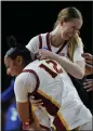  ?? ASHLEY LANDIS — AP ?? India Otto, top, celebrates with JuJu Watkins after the Trojans' first-round victory.