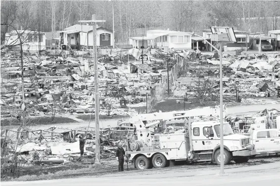  ?? RYAN REMIORZ, THE CANADIAN PRESS ?? What had been a mobile-home park in Fort McMurray was largely consumed by the massive wildfire that roared through last week.