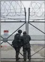  ?? (AP/Yonhap/Park Dong-joo) ?? South Korean marines close a gate on Yeonpyeong Island, South Korea, on Saturday.