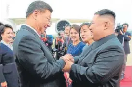  ?? AFP FILE ?? North Korean leader Kim Jong Un (R) shaking hands with Chinese President Xi Jinping upon his arrival at Pyongyang internatio­nal airport.