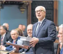  ?? CP PHOTO ?? Quebec Finance Minister Carlos Leitao tables his budget, Tuesday at the National Assembly in Quebec City.