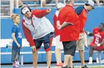  ?? JIM RASSOL/STAFF PHOTOGRAPH­ER ?? New FAU football coach Lane Kiffin says he’s happy that it to have his son Monte Knox Kiffin around more often. will be easier