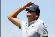  ?? AP/CHRIS CARLSON ?? Jason Day of Australia reacts after missing a putt on the ninth hole Friday. Day shot a 3-over 75 and was one of eight players ranked in the top 12 who failed to make the cut.