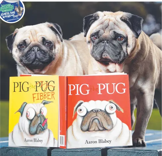  ?? Picture: TOM HUNTLEY ?? Shelby and Henry get close to another famous pug, who you can read all about in The Great Australian Storybook Collection.