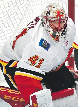  ?? ED KAISER ?? Flames goalie Mike Smith allowed four goals on 21 shots Saturday in a pre-season loss to Edmonton.