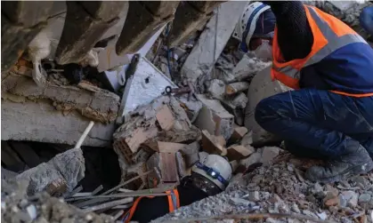  ?? Photograph: Yasin Akgül/AFP/ Getty Images ?? Rescuers extracting bodies from the rubble of Antakya, where a survivor was found 10 days after the quake.