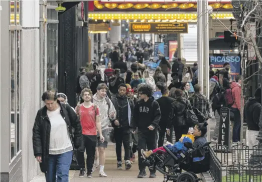  ?? TYLER PASCIAK LARIVIERE/SUN-TIMES FILE ?? Weekend foot traffic has picked up in the Loop, as is seen here at State and Lake streets this winter.