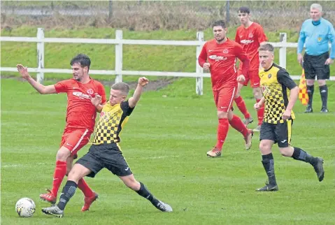  ??  ?? Super League action from Brownlands Park where Luncarty and Carnoustie (red) shared four goals.