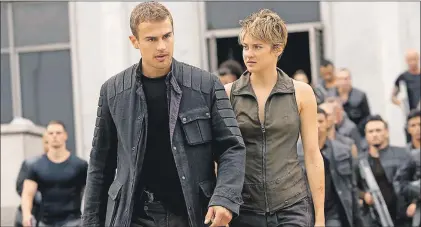  ?? ASSOCIATED PRESS ?? Theo James (left) and Shailene Woodley appear in a scene from "The Divergent Series: Insurgent."