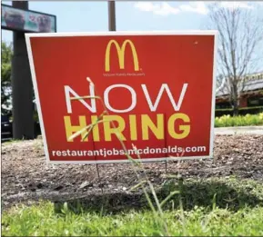  ?? GETTY IMAGES/AFP JUSTIN SULLIVAN/ ?? A now hiring sign is posted in front of a McDonald’s restaurant on May 5 in Baton Rouge, Louisiana. Protest groups are gathering next week to call for the US giant – the country’s second-largest employer – to pay an hourly minimum wage of $15.