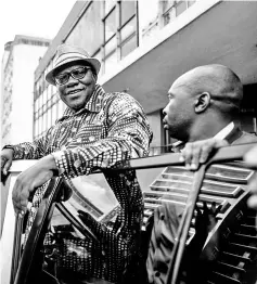  ?? — AFP photo ?? File photo of Biti (centre) greeting supporters outside the MDC Alliance’s headquarte­rs in Harare.