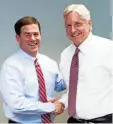  ?? TOM TINGLE/THE REPUBLIC ?? Then-gubernator­ial candidates Doug Ducey, left, and Fred DuVal greet each other after meeting with The Arizona Republic editorial board on Oct. 1, 2014.