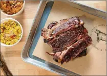  ?? CONTRIBUTE­D BY MIA YAKEL ?? 4 Rivers Smokehouse St. Louis Ribs Half Rack is served with homestyle sides of Smokehouse Corn and Sweet Potato Casserole.