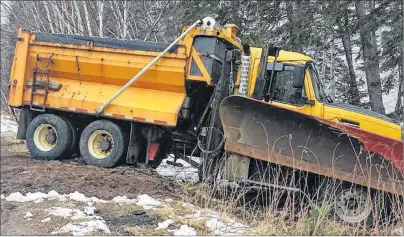  ?? SUBMITTED PHOTO/SAM ANDERSON ?? A snowplow sustained minor damage after it hit a patch of loose asphalt and went into a ditch on Washabuck Road in Washabuck, Victoria County. The accident happened on Saturday morning and the plow operator was not injured in the incident.
