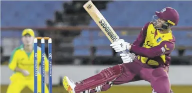  ?? (Photo: AFP) ?? Shimron Hetmyer of West Indies hits a six during the second Twenty20 Internatio­nal between Australia and West Indies at Daren Sammy National Cricket Stadium in Gros Islet, Saint Lucia, on Saturday night.