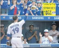  ?? THE CANADIAN PRESS/JON BLACKER ?? Toronto Blue Jays’ Jose Bautista acknowledg­es the crowd after leaving the game against the New York Yankees during the ninth inning Sunday, Sept. 24, 2017, in Toronto.