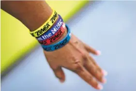  ?? FILE PHOTO BY EMILY BERL/THE NEW YORK TIMES ?? A Zumba instructor shows her bracelets at a class in New York, An edict issued this month by the head of Iran’s Sports for All Federation effectivel­y banned Zumba classes for being contrary to Islamic precepts, to the dismay of many in a fitness-minded...