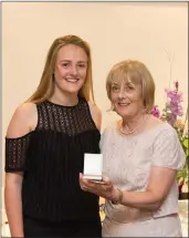  ??  ?? Sophie Stapelton, a winner in the Lady President’s Prize in Blainroe Golf Club, receives her prize from the Lady President Bernie Nelson.