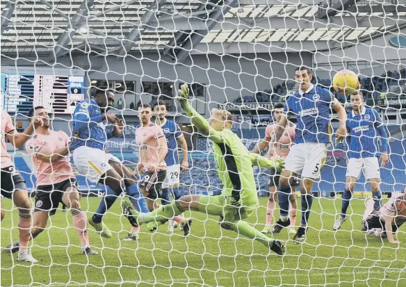  ??  ?? Brighton and Hove Albion’s Danny Welbeck scores against Sheffield United.