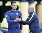  ??  ?? Well played Livingston assistant David Martindale shakes Vaclav Hladky’s hand