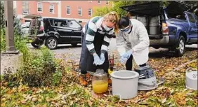  ?? Paul Buckowski / Times Union ?? Siena College students collect wastewater near a dorm in late 2020. Once the infrastruc­ture is in place, experts predict wastewater testing has the potential to become a powerful and cost-effective public health tool.