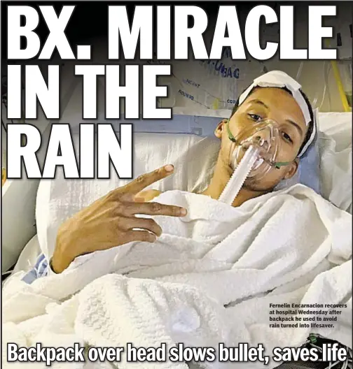  ??  ?? Fernelin Encarnacio­n recovers at hospital Wednesday after backpack he used to avoid rain turned into lifesaver.