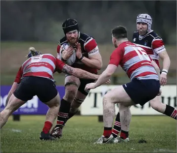  ??  ?? Wicklow’s Liam Gaffney looks to break the tackle of Mullingar’s Nigel Mills during the Bank of Ireland Provincial Towns Cup at Ashtown Lane, Wicklow. Picture: Garry O’Neill