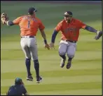  ?? Associated Press ?? JUMP FOR JOY — The Astros’ Carlos Correa, left, celebrates with George Springer after they defeated the Oakland Athletics, 10-5, in Game 1 of the American League Division Series in Los Angeles on Monday.