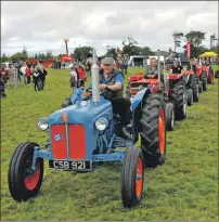 ??  ?? Vintage tractors process into the show ring. 16_T33_ Islay Show_ 08