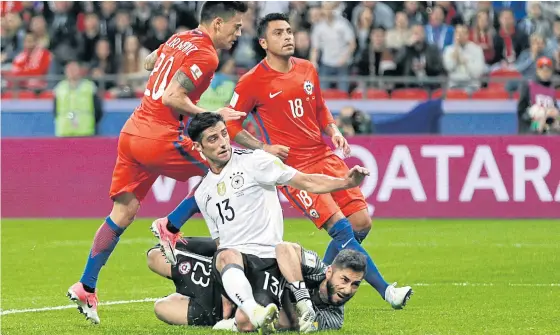  ??  ?? Germany’s Lars Stindl, No.13, scores against Chile.