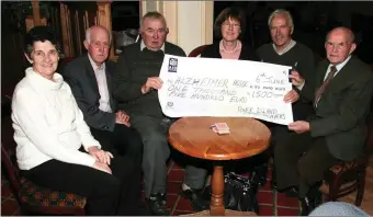  ?? Photo by John Reidy ?? Card players with a cheque for the Alzheimers Associatio­n: Tess Brosnan (left) is pictured with Pat Sheehy, Teddy Brosnan, Kathleen Herlihy, Gerard Burke and Peter Tangney.