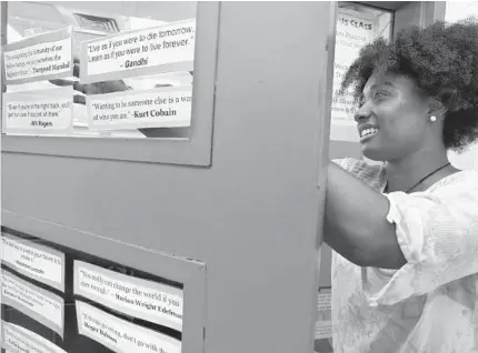  ?? AMY DAVIS/BALTIMORE SUN ?? Jocelyn Providence sets up her math classroom at Digital Harbor High School before school begins. Last year, African-American children made up about 80 percent of the student body in Baltimore schools. Only about 40 percent of the district’s 4,900 teachers were black.