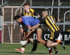  ??  ?? Glen Malone under pressure from Cian O’Dwyer and Shane McEntee.