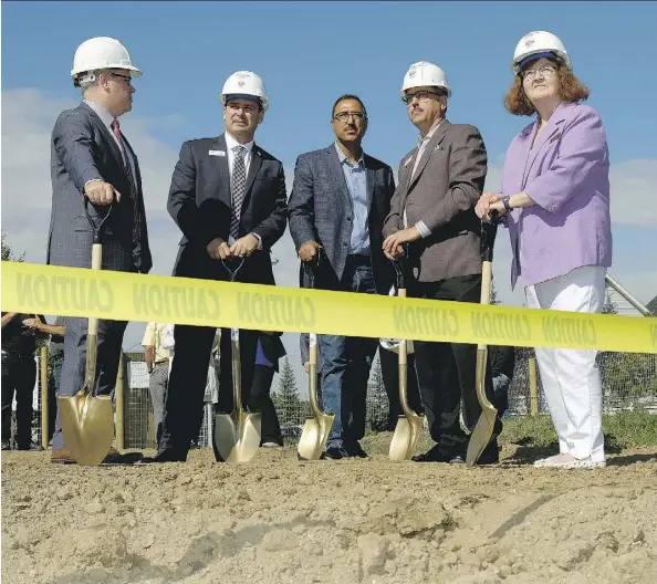  ?? LARRY WONG ?? From left, Scott Russill of Alberta Investment Management Corp., Greg Dewling of Capital Region Housing, Edmonton Mill Woods MP Amarjeet Sohi, RMS Group president Curtis Way and Edmonton-Mill Creek MLA Denise Woollard at Monday’s ground-turning...