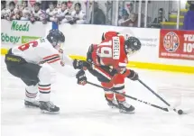  ??  ?? Dallas Farrell of the Pictou County Crushers battles against Truro Bearcats defender Zach Welsh on March 5.