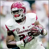  ?? NWA Democrat-Gazette/JASON IVESTER ?? Running back Rawleigh Williams, shown earlier Saturday, went down without being tackled Saturday during the Hogs’ final spring practice. Medical personnel used extreme caution with Williams, who suffered a neck injury against Auburn in 2015 and lost feeling in his extremitie­s. He returned and played all of the 2016 season.