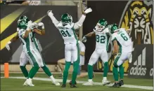  ?? Canadian Press photo ?? Saskatchew­an Roughrider­s wide receiver Naaman Roosevelt (82) celebrates his touchdown with teammates during second-half CFL Football action against the Hamilton Tiger-Cats in Hamilton, Ont., on Friday.