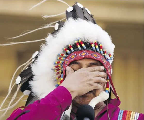  ?? DAVID BLOOM ?? An emotional Adam North Peigan, president of the Sixties Scoop Indigenous Society of Alberta, wipes away tears Monday as he responds to a formal apology by Premier Rachel Notley to survivors and families of the Sixties Scoop at the Alberta legislatur­e.